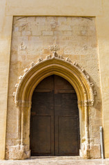 Fototapeta na wymiar Church door in the historic center of Xativa