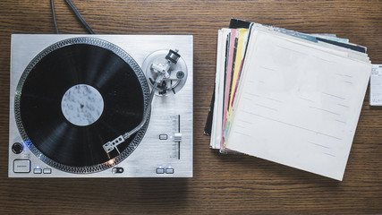 overhead view of the turntable with the vinyl records collection