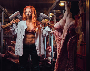 Redhead female in a meat factory.