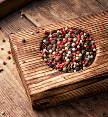 peppercorn in rustic mortar