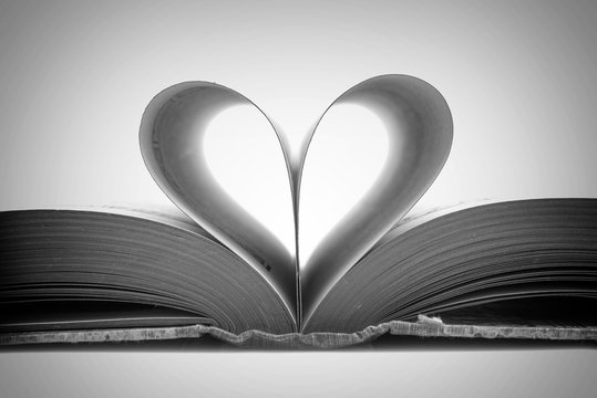 Book pages in the shape of a heart, black and white photography