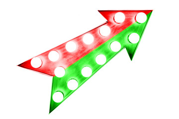 Bright intense divided red and green arrow upwards as a vintage bright and colorful illuminated display frame with light bulbs isolated on a white background