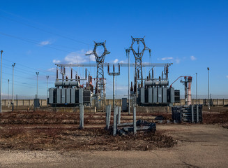 Fototapeta na wymiar blue sky over desolate area with power plant