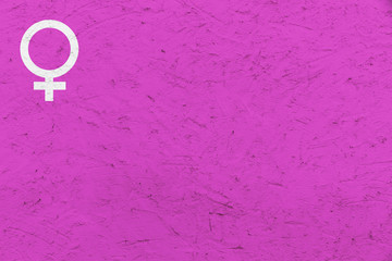 Female gender symbol (Venus sign) over pink uneven texture background. Concept background image for gender, feminine, woman and girl.