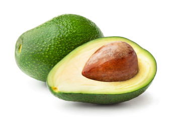 whole and cuted avocados isolated on white background