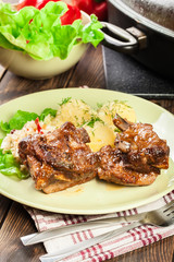 Pork spare ribs served with mashed potatoes and sauce