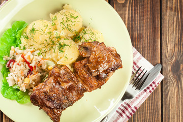 Pork spare ribs served with mashed potatoes and sauce