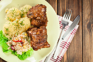 Pork spare ribs served with mashed potatoes and sauce