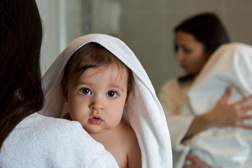 mother in a Bathrobe and with a child