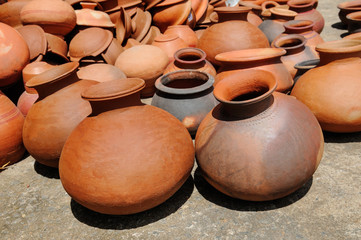 Fototapeta na wymiar Background of a pots, dishes, and other articles made of baked clay.