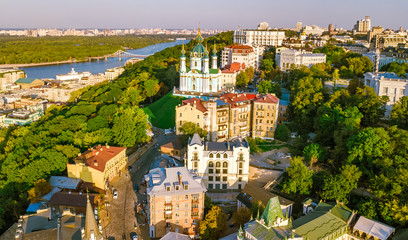 Aerial top view of Saint Andrew's church and Andreevska street from above, cityscape of Podol...