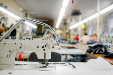 Sewing machine on clothing fabric, nobody