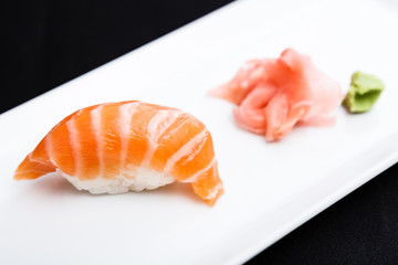 Salmon sushi served on a plate