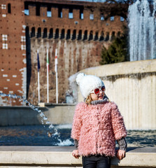 modern girl in Milan, Italy looking aside