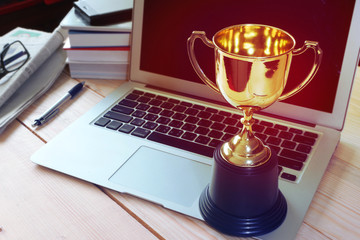 Trophy on working table , winner concept.