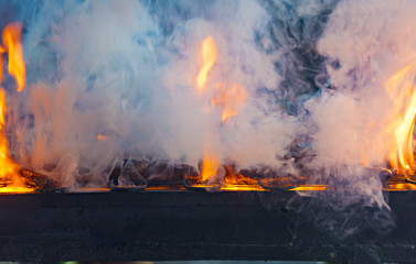 Coal Fire and Smoke for BBQ as background