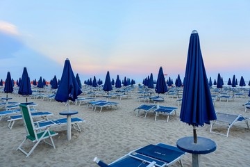 Beach with blue umbrellas