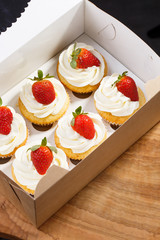 strawberry capcake in a cardboard box