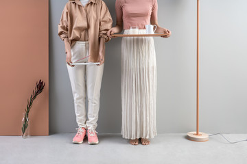 Girls holding tray and support