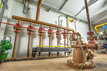 Levers on the oil manifold in the compressor room.