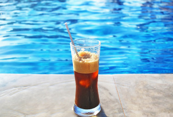cold espresso coffee in front of the swimming pool - summer resort Greece