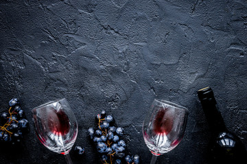 restaurant set with wine bottle and grape on stone top view mock