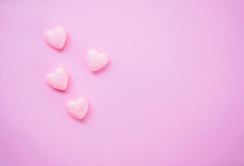 Fototapeta premium The 14th of February. St. Valentine's Day. Background with fluffy pink hearts on a pink background. Top view with copy space