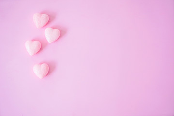 The 14th of February. St. Valentine's Day. Background with fluffy pink hearts on a pink background. Top view with copy space