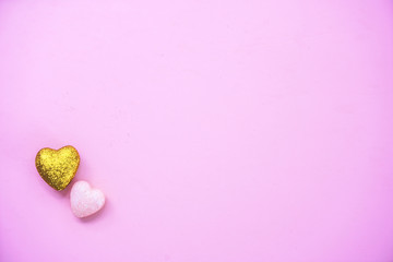 The 14th of February. St. Valentine's Day. Background with fluffy pink and gold hearts on a pink background. Top view with copy space