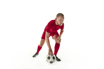 Professional football soccer player with ball isolated white background