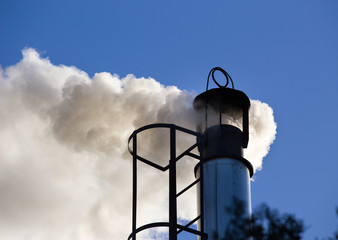 Fototapeta na wymiar Industrial chimney with smoke