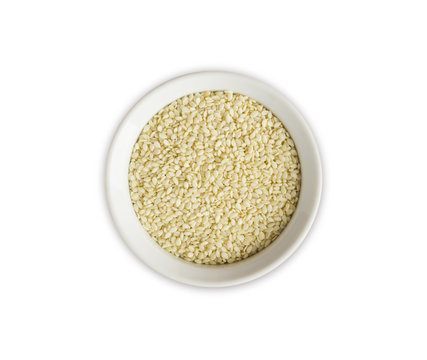 Sesame on white background. Top view. Sesame in a bowl isolated on white background. Sesame with copy space for text.