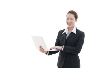 Business concept : Smiling young Asian businesswoman in black suit and white shirt holding laptop isolated on white background