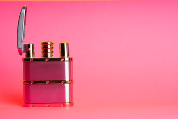 Cigarette lighter on a pink color background