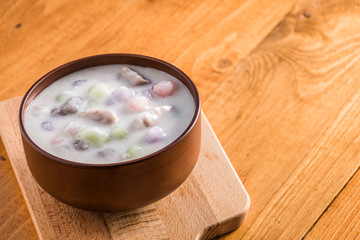 Thailand dessert, Bua Loy in cup on wooden.

