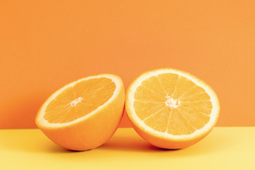 Orange slice isolated on orange background.