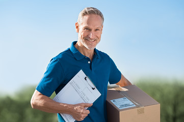 Delivery man holding parcel