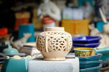 Vintage. Unique handmade ceramic vases. Clay pots stacked in a yard. Pottery making place. Local craft