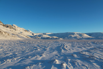 Sunset over the snowy fields in central Iceland