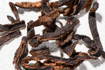 Chinese herbal medicines -- dried tangerine or orange peel isolated on white background