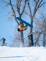 Naklejka na ściany i meble People are having fun in downhill skiing and snowboarding 