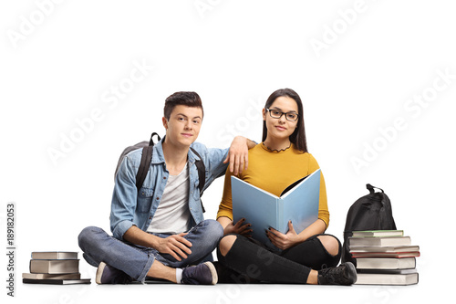 Teen Students With Books Sitting On The Floor Stock Photo And