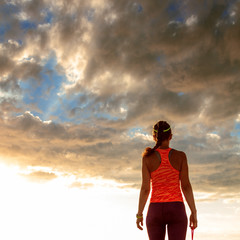 healthy woman in sportswear on seashore walking