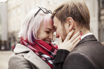Fototapeta premium Long-awaited meeting of the two lovers. Portrait of emotional young couple in love hugging each other. (happiness, love, romance, sensuality concept)