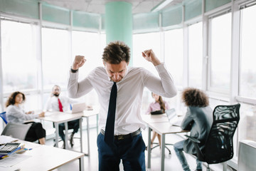 Business manager making fists because is angry. Made some mistakes in agreement.