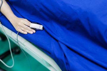 health hospital concept with sick woman with Closeup saline water line on a hand of patient and infusion line in a patients hand and body rehabilitation time in the hospital