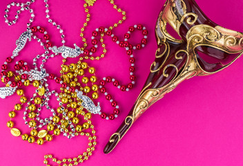 Carnival elegant male venetian  mask and beads.
