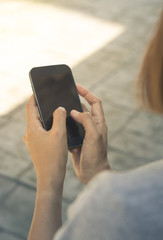 Smart phone in woman hand.
