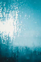 Naklejka na ściany i meble Window transparent blurred foggy glass with condensated water drops monochrome background. Vibrant freshness simplicity texture, season mood image