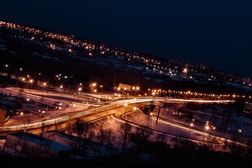 Fototapeta na wymiar night city view with transport interchange, lights and traffic 